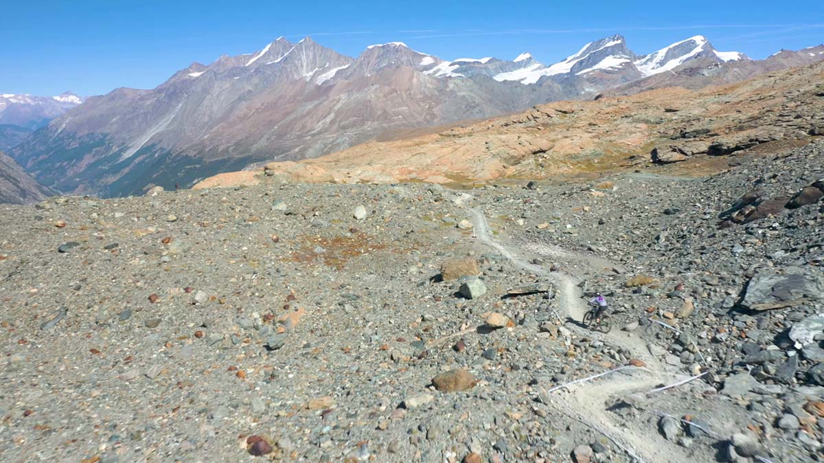 ews zermatt 2019 racer on track moonscape terrain rocky massive pointy mountain backdrop