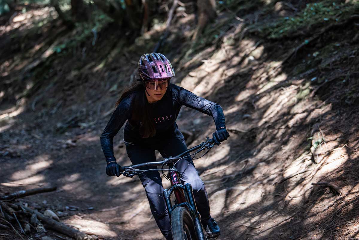 mountain biker riding 2021 scott contessa ransom womens enduro bike singletrack