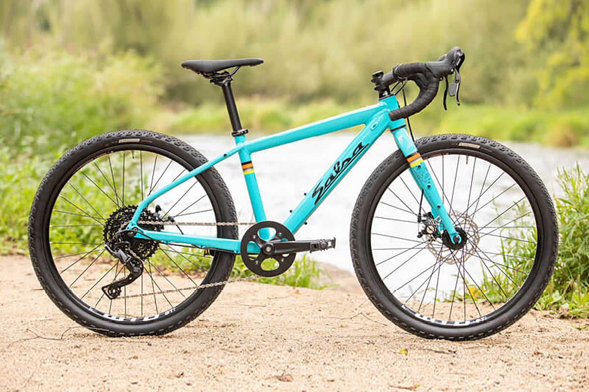 salsa journeyman 24 inch wheel size gravel bike for youth shown in teal blue color