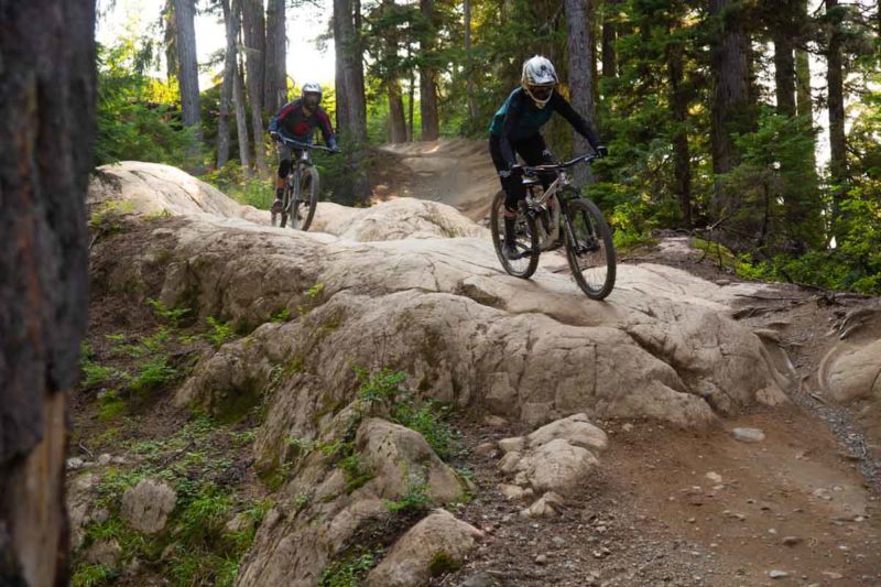 Knolly Chilcotin, riders on rock slab