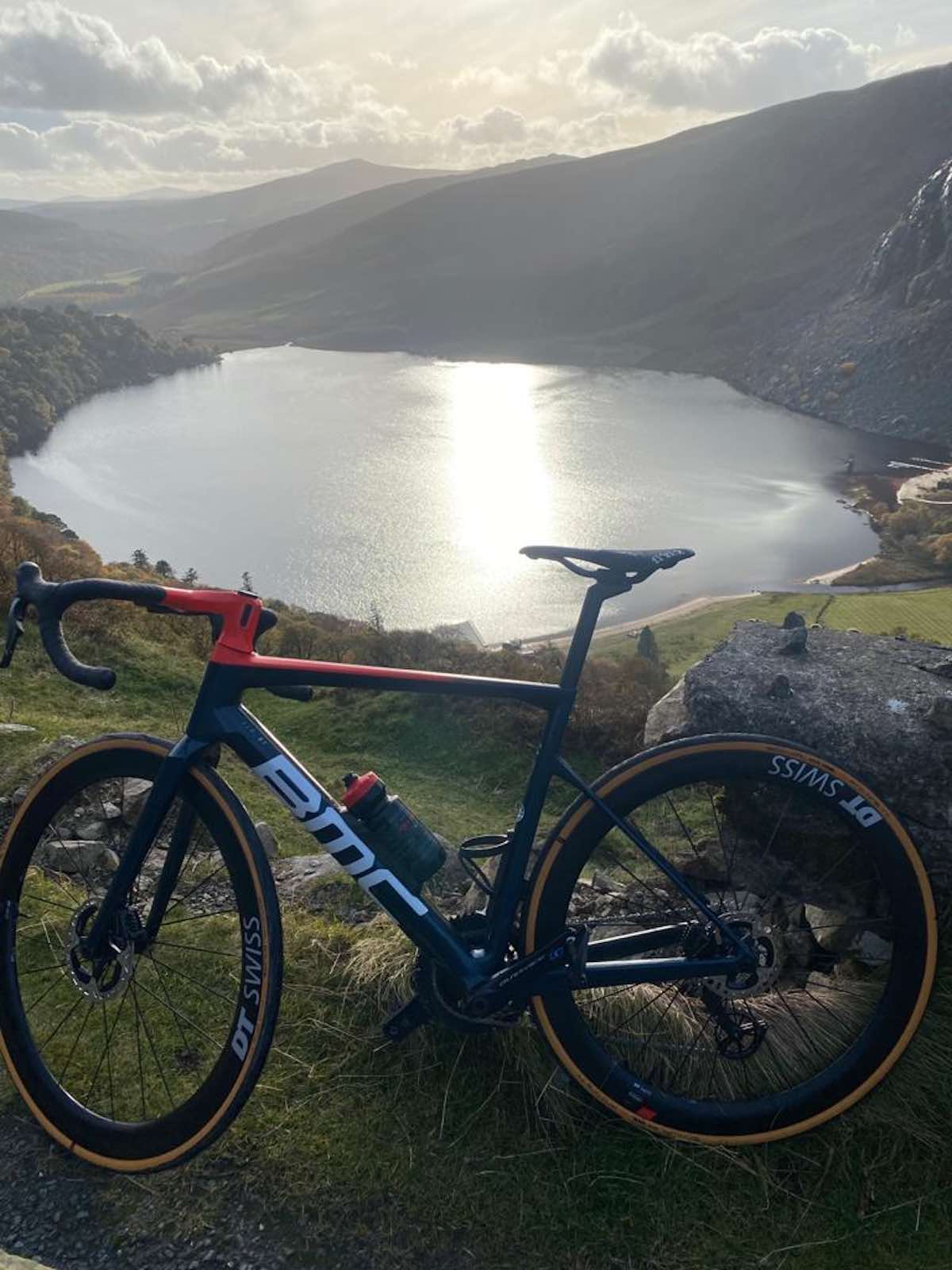 bikerumor pic of the day gmcy bicycle at the top of a mountain looking down into a lake at Bongo’s Hole, King’s Road, County Wicklow, ireland.