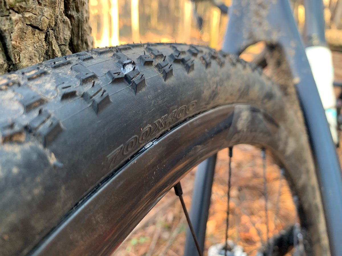 gravel bike tire with pinch flat leaking sealant out