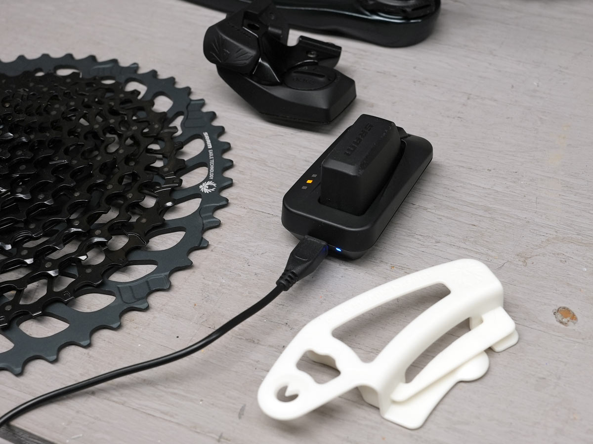 sram gx eagle axs comparison and upgrade kit components shown on a workbench