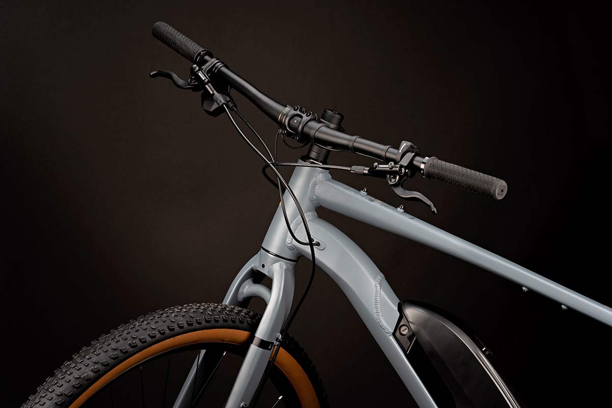 Cairn Brave adventure e-bike, rigid alloy off-road gravel bikepacking mountain eMTB, flat bar detail