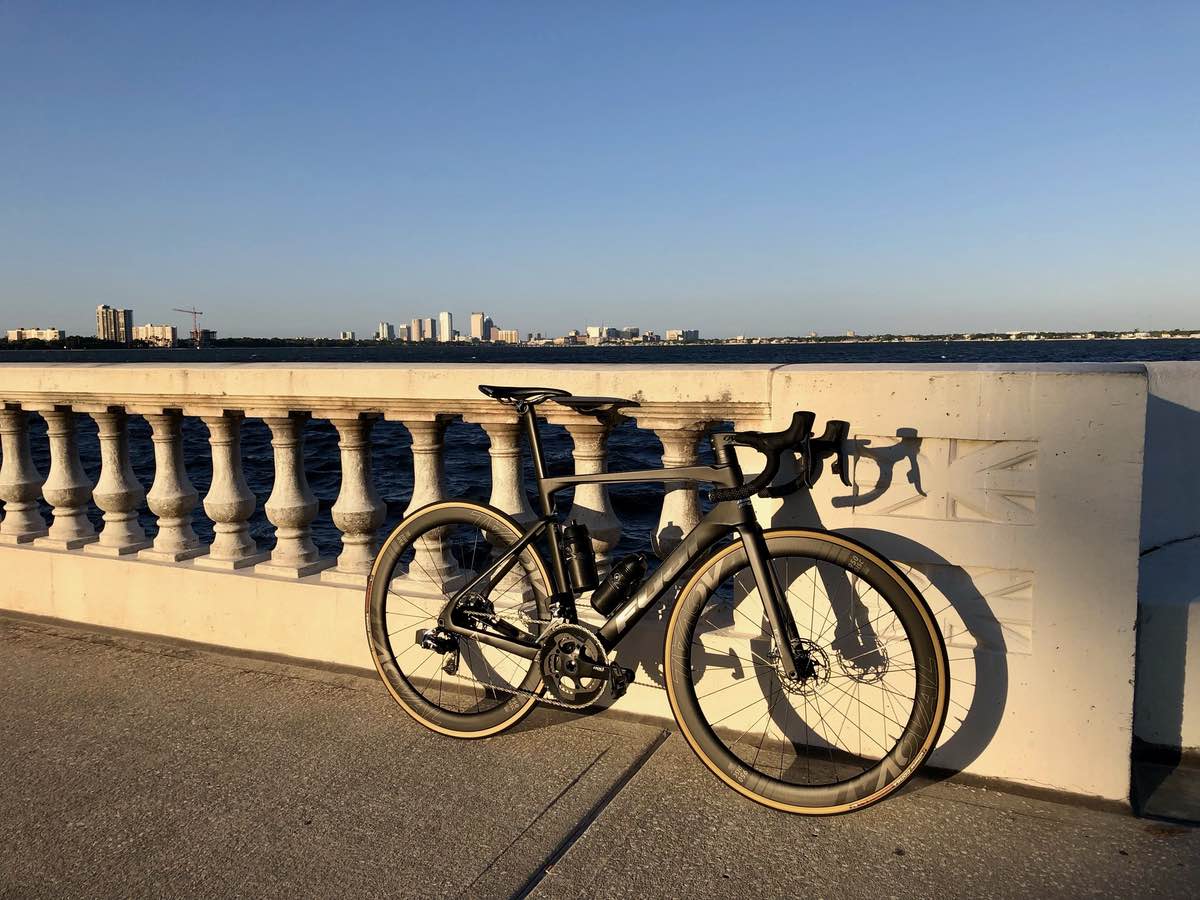 bikerumor pic of the day a fuji transonic 1.1 on bayshore boulevard in tampa the light is low in the evening and lighting up the concrete wall along the shore with the city in the background.
