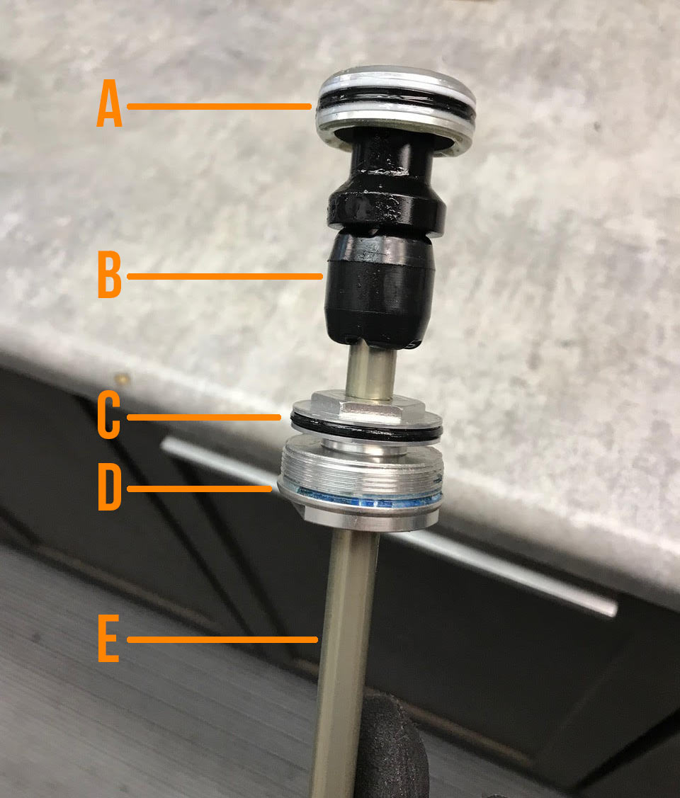 diagram showing parts of eq air spring for auron mountain bike fork