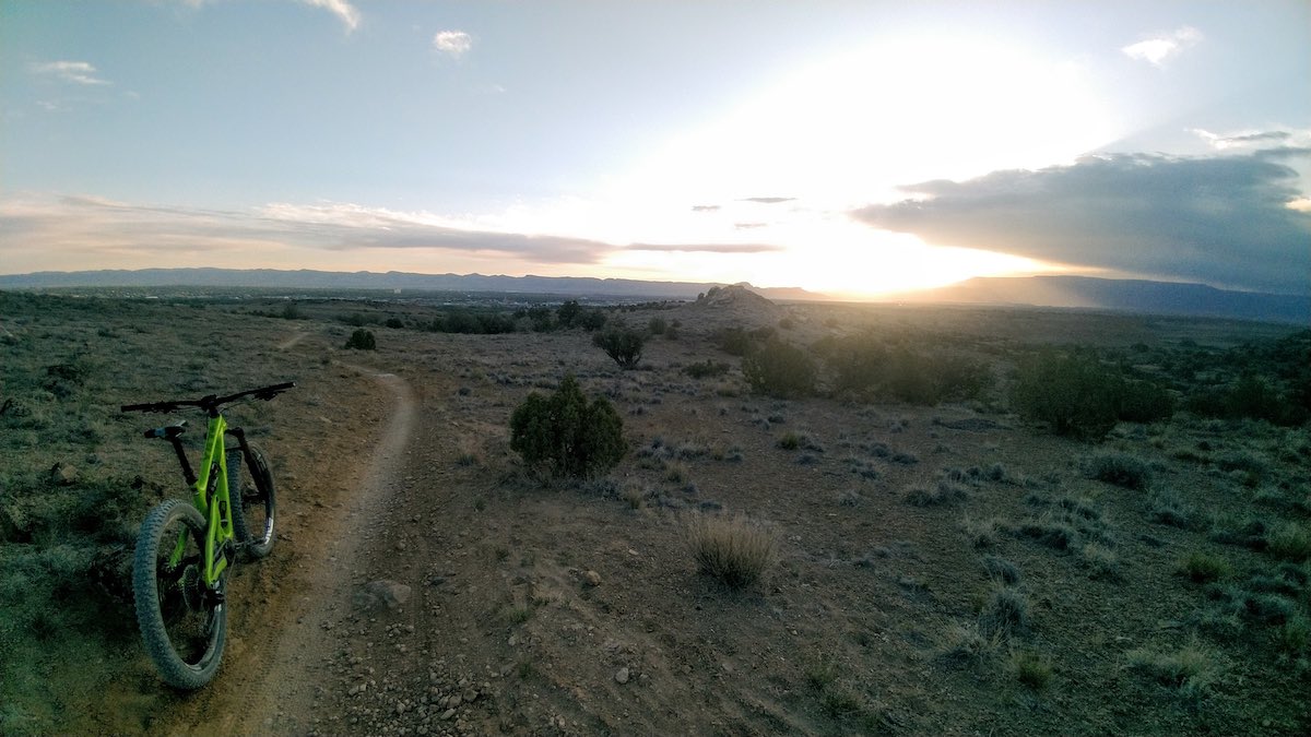 bikerumor pic of the day a bicycle is along a dirt path as the sun rises in grand junction colorado