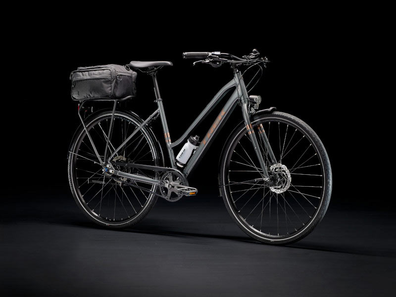 trek district step through commuter bike with rear rack and powered lights