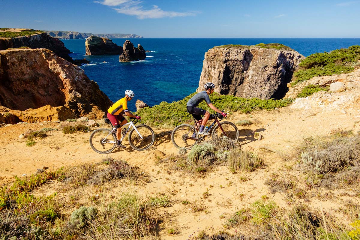 riding gravel bikes on rocky cliffs in portugal along the coast with thomson bike tours new off road trips