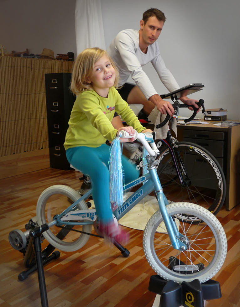 youngster riding a bicycle on indoor cycling trainer