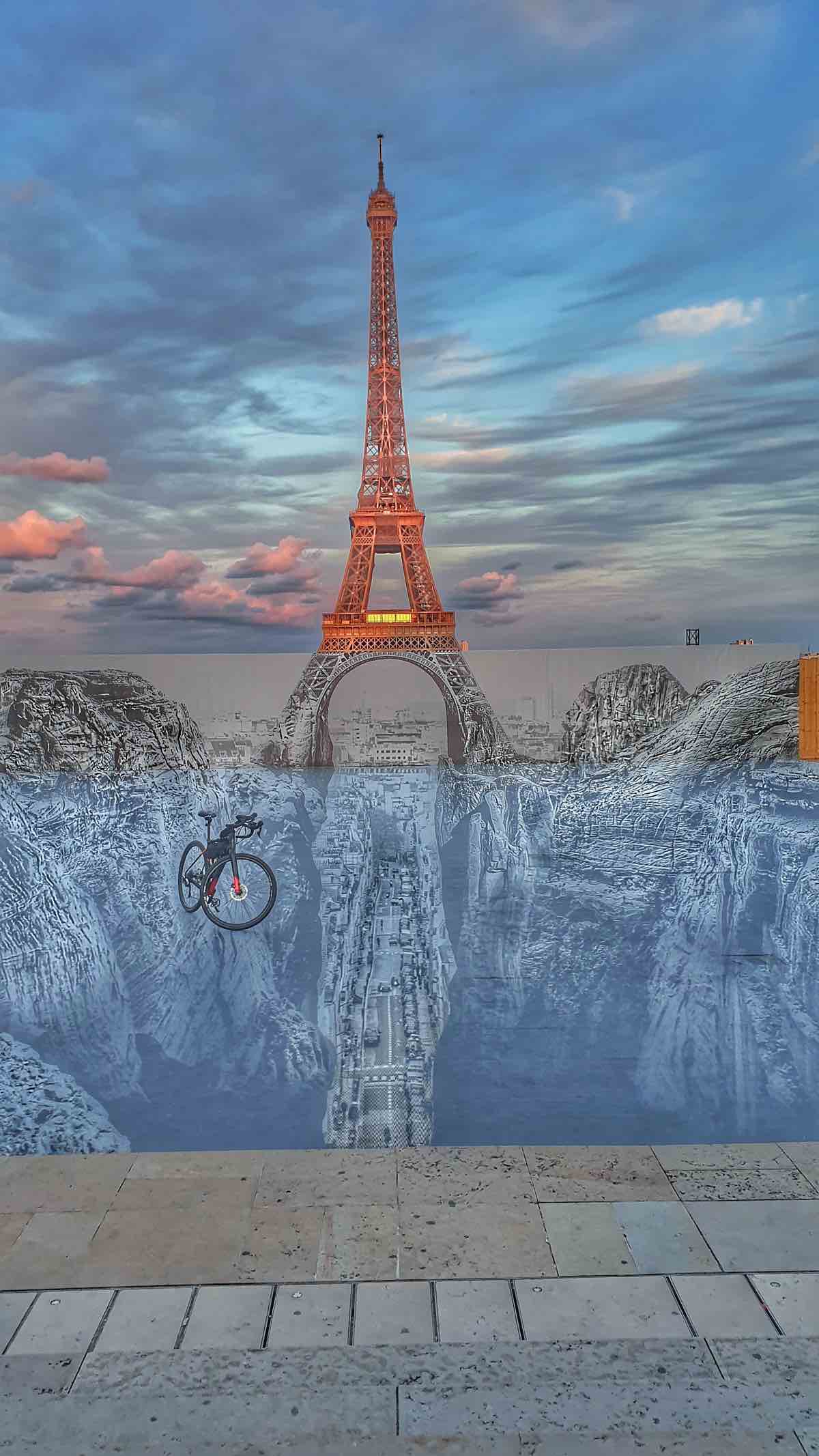 bikerumor pic of the day a specialized diverge seems to float above a scene anchored by the eiffel tower on street art created on the place du trocadero in paris france.