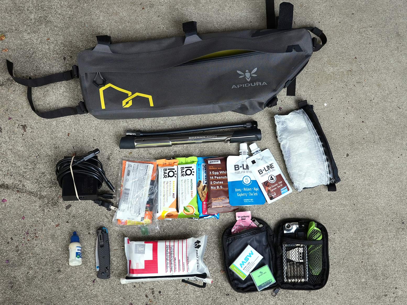 contents laid out showing what all will fit inside the apidura expedition frame pack