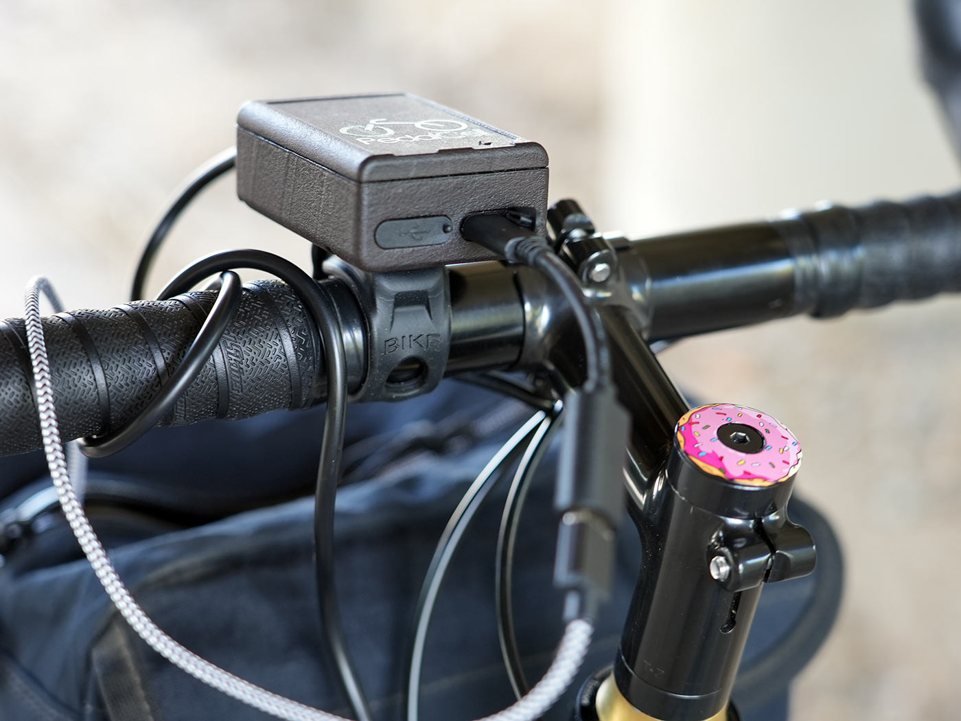pedalcell bicycle dynamo control box with USB outlets shown on a handlebar