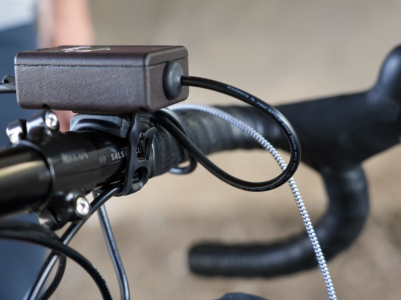 pedalcell bicycle dynamo control box with USB outlets shown on a handlebar