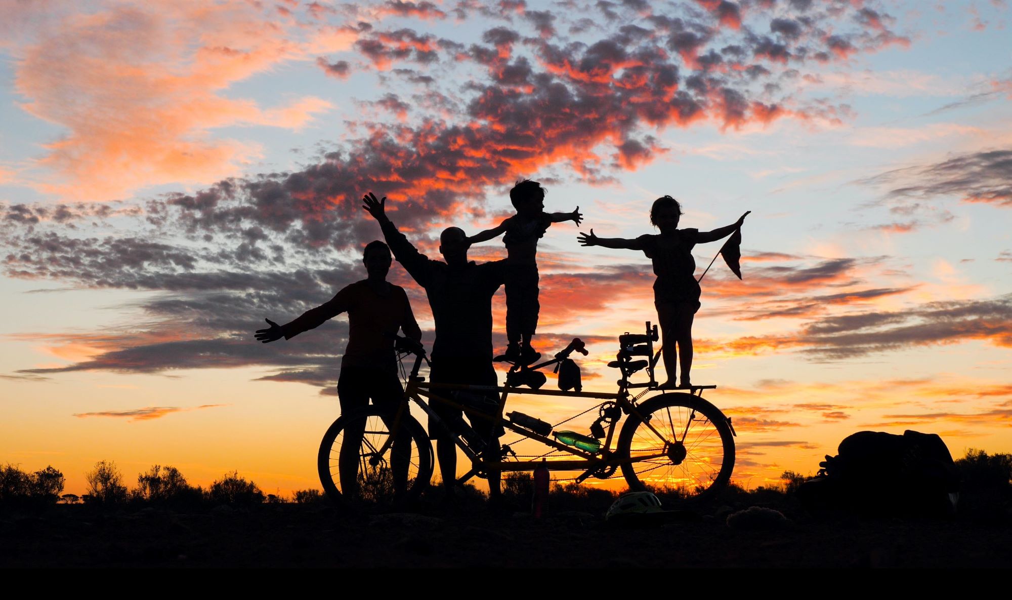 family bicycle sunset