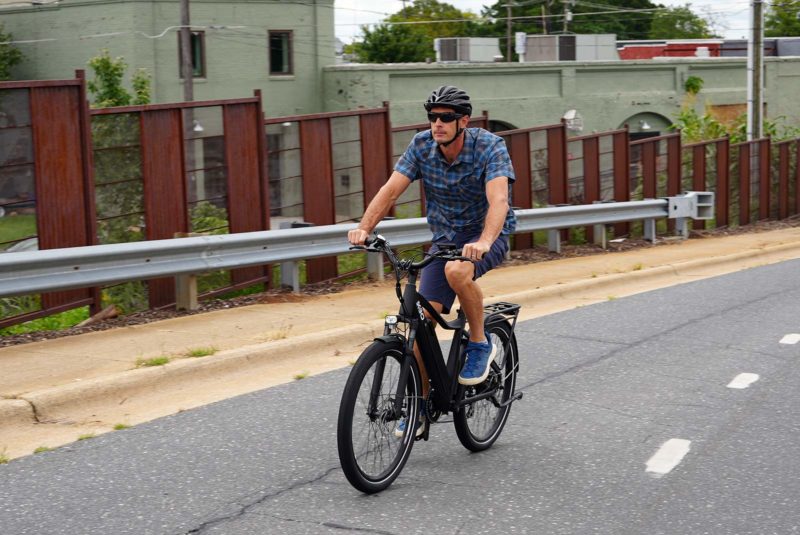 riding up the street for the kbo commuter e-bike review