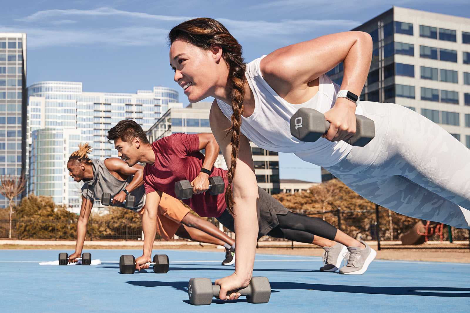 group of people working out with new fitbit charge 5 fitness tracker smartwatch