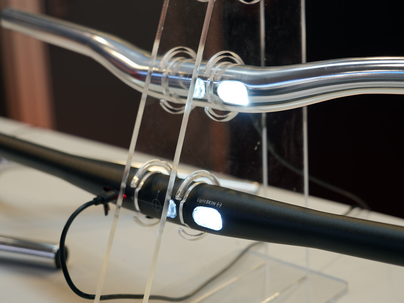 lightskin bicycle handlebar with integrated tail lights