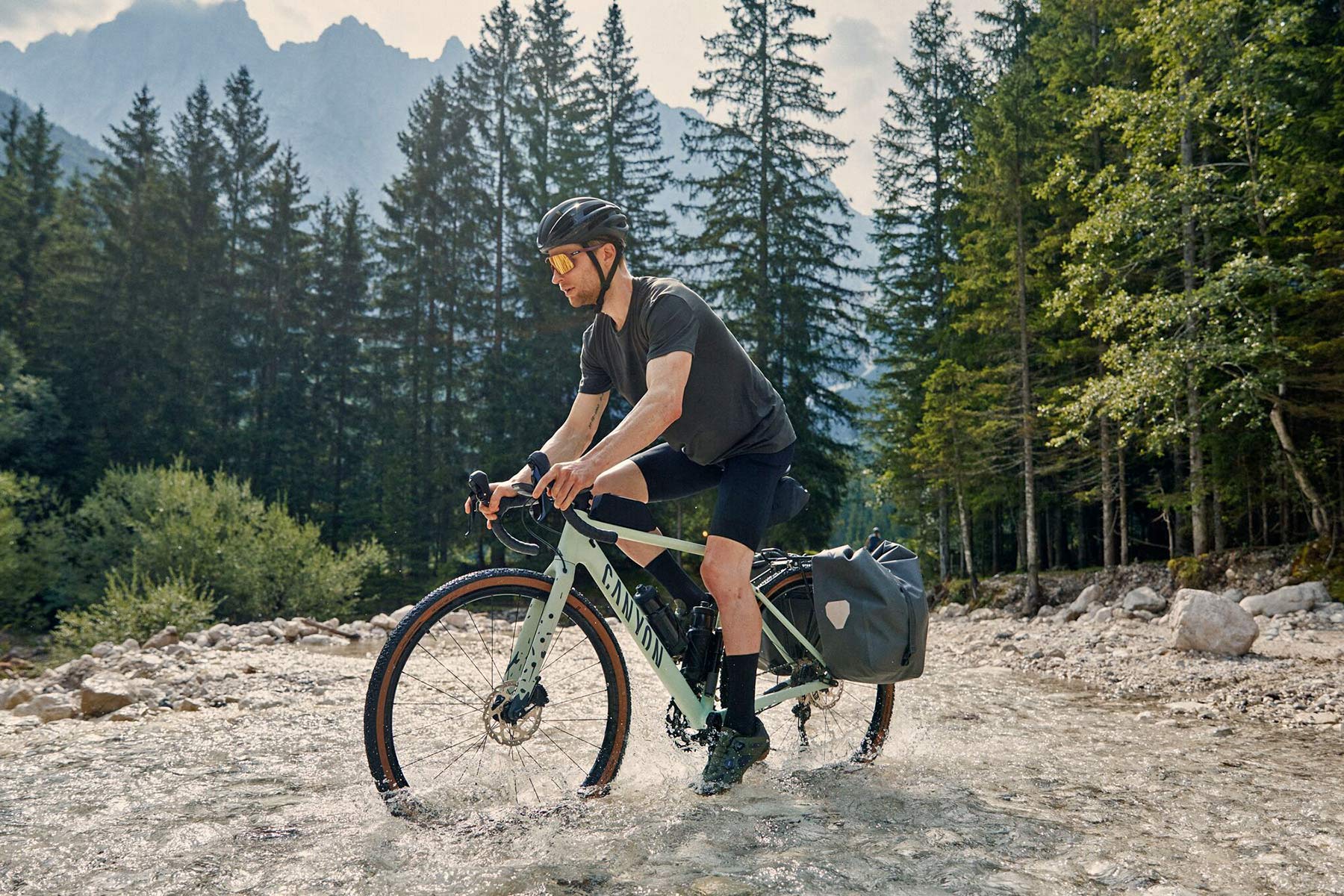 Canyon Grizl AL affordable alloy adventure gravel bike, photo by Marco Freudenreich, river crossing Slovenia