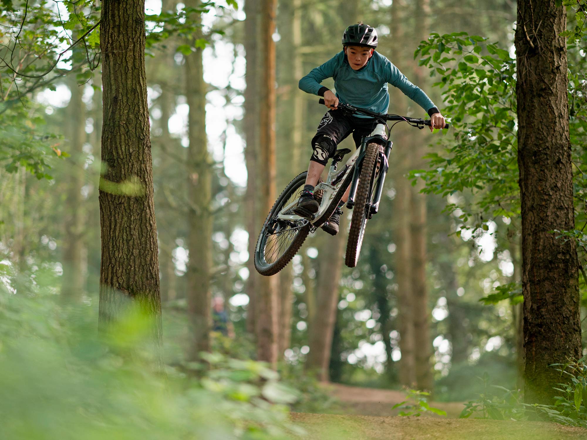 2022 Canyon Spectral AL affordable alloy trail all-mountain bike, photo by Roo Fowler, young hero airtime