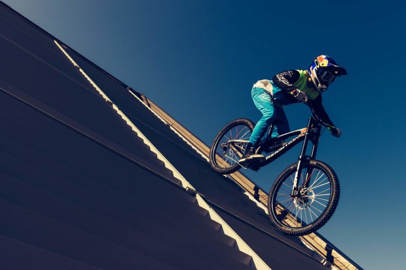 Getting a sense of scale for the Red Bull Rampage, photo by William Saunders, Jaxson Riddle rides off a 4-story building