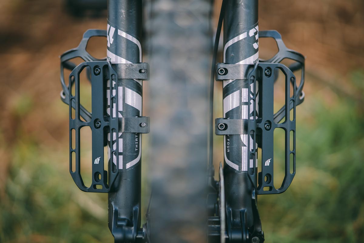 four cargo cages on mountain bike suspension fork
