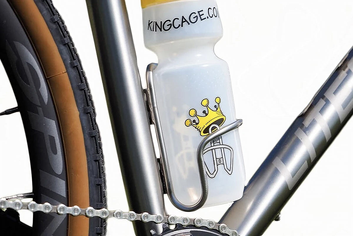king cage side loader water bottle cage for left or right side water bottle removal shown on a bike