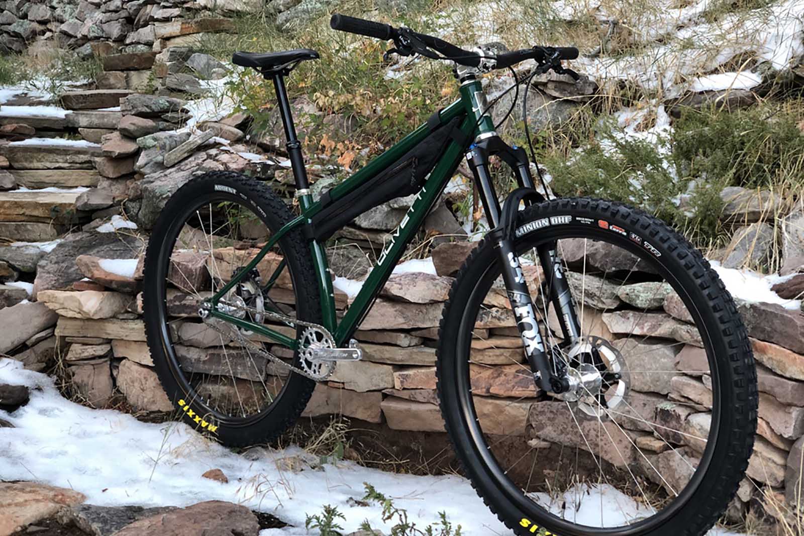 an olivetti bike against a stone background