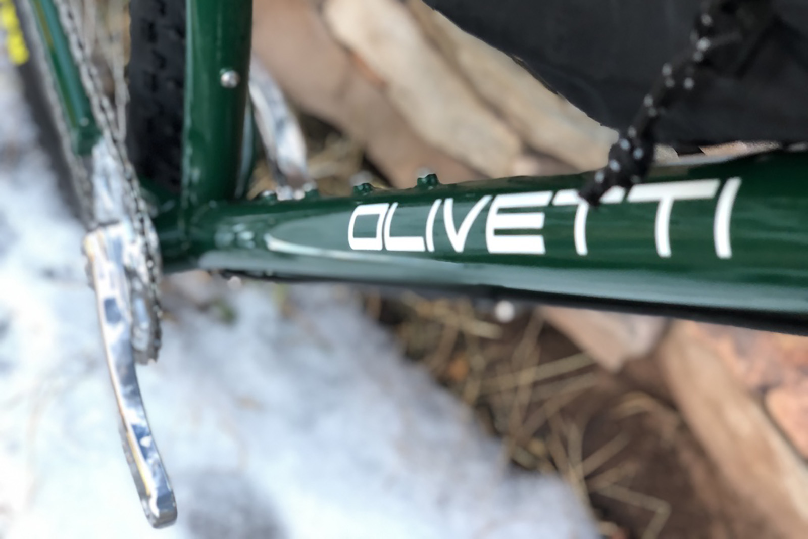 a close up of the downtube on an olivetti steel frame
