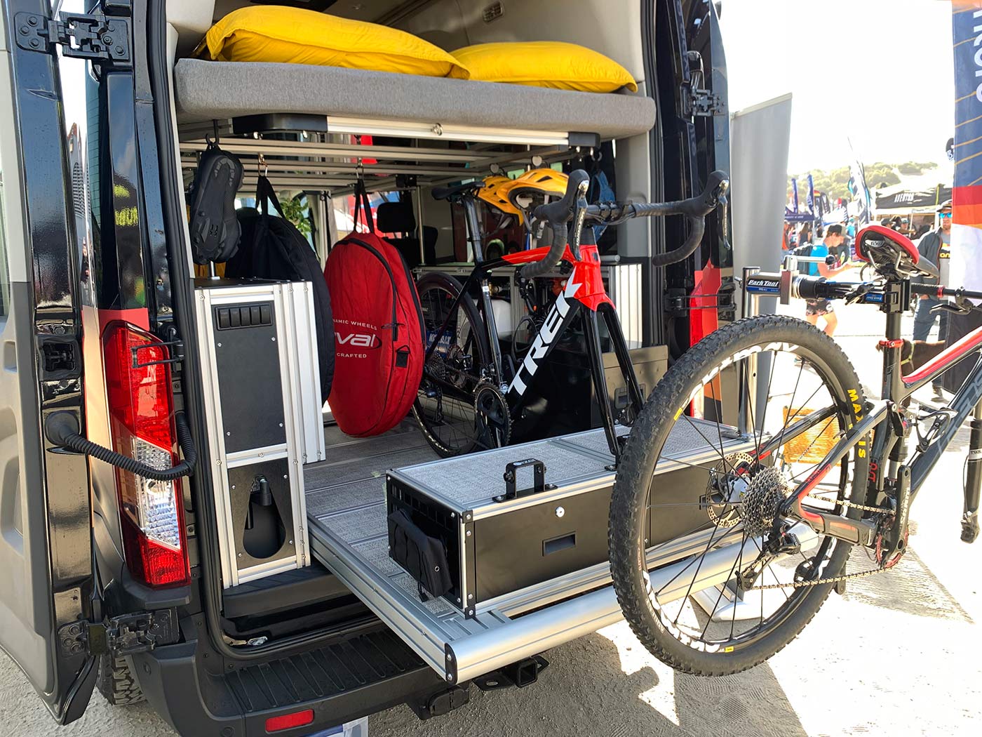 vandoit custom camper van with modular interior and slide-out bike tray and workstand