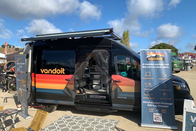 vandoit custom camper van with modular interior and slide-out bike tray and workstand