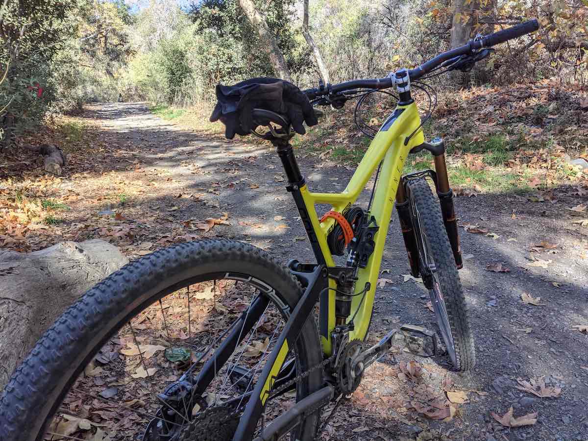 bikerumor pic of the day a yellow mountain bike is on a mountain dirt trail.