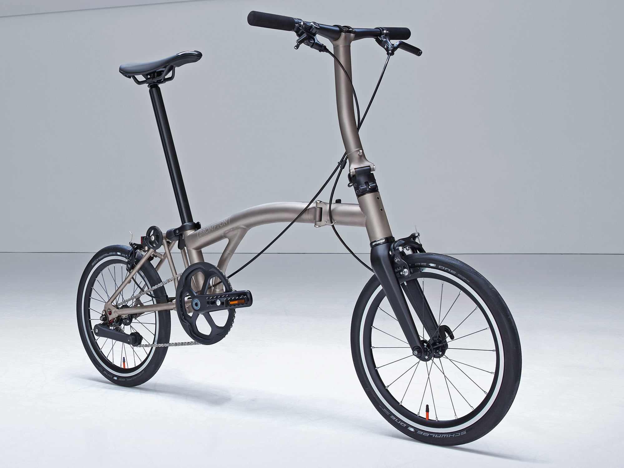 Brompton T Line ultralight titanium folding commuter bikes, angled