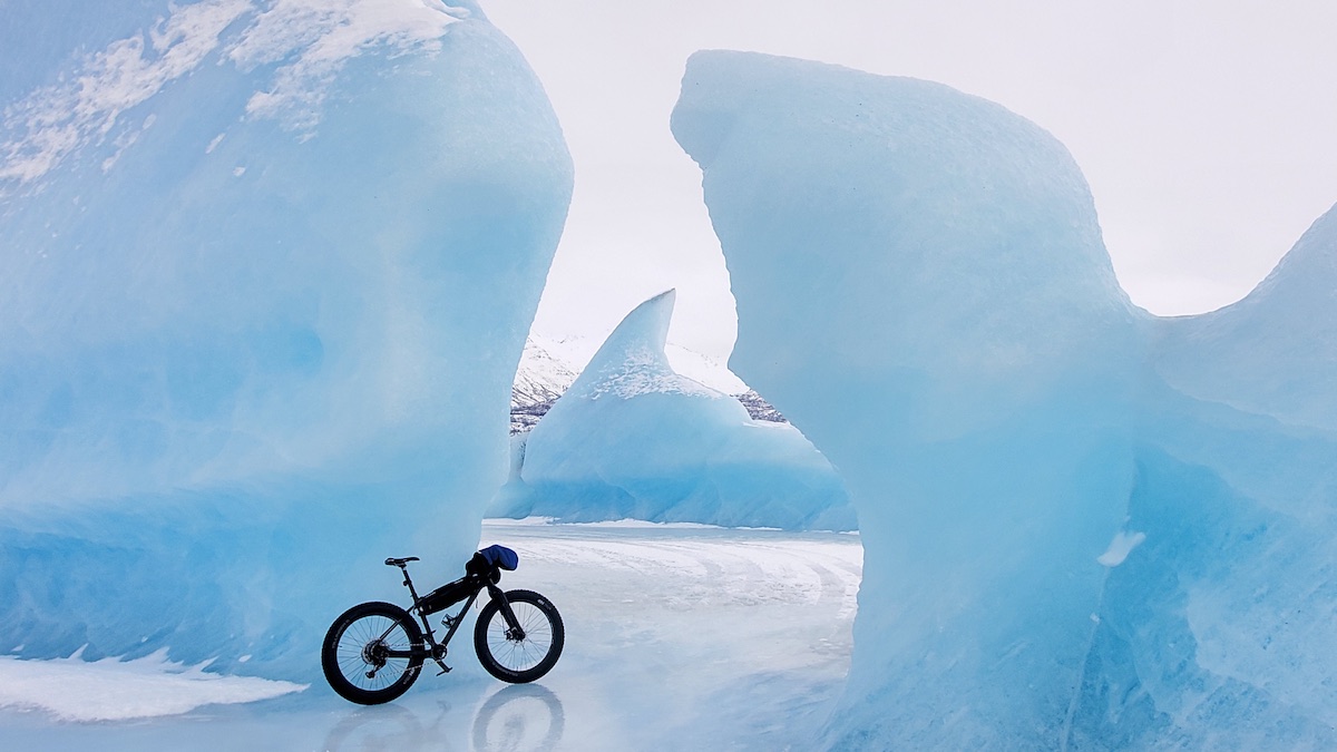Bikerumor pic of the day a fat bike leans against an outcropping of ice along a glacier in palmer alaska.