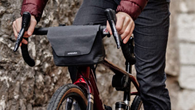 Apidura City Handlebar Pack snaps easy-access bikepacking bag on commuter bike bars