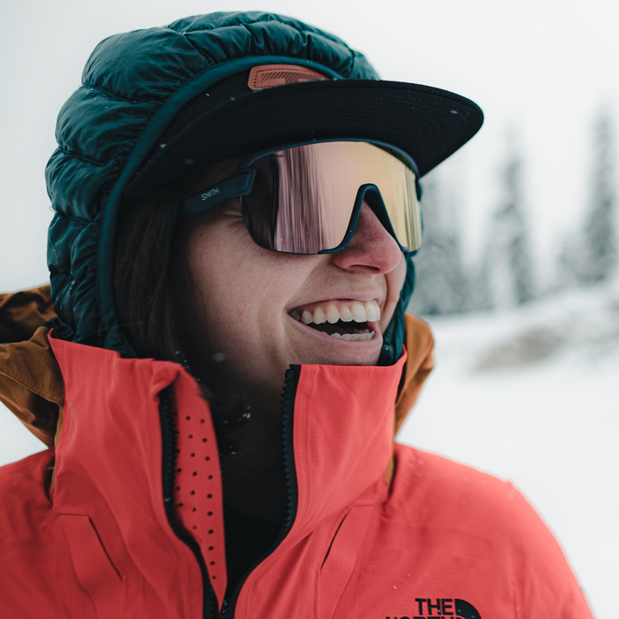 Woman wearing Smith Bobcat Sunglasses in a snowy outdoor space.