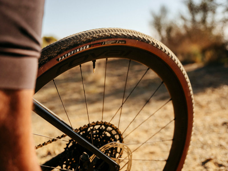 specialized s-works pathfinder gravel bike tire shown on a bike riding on dirt roads