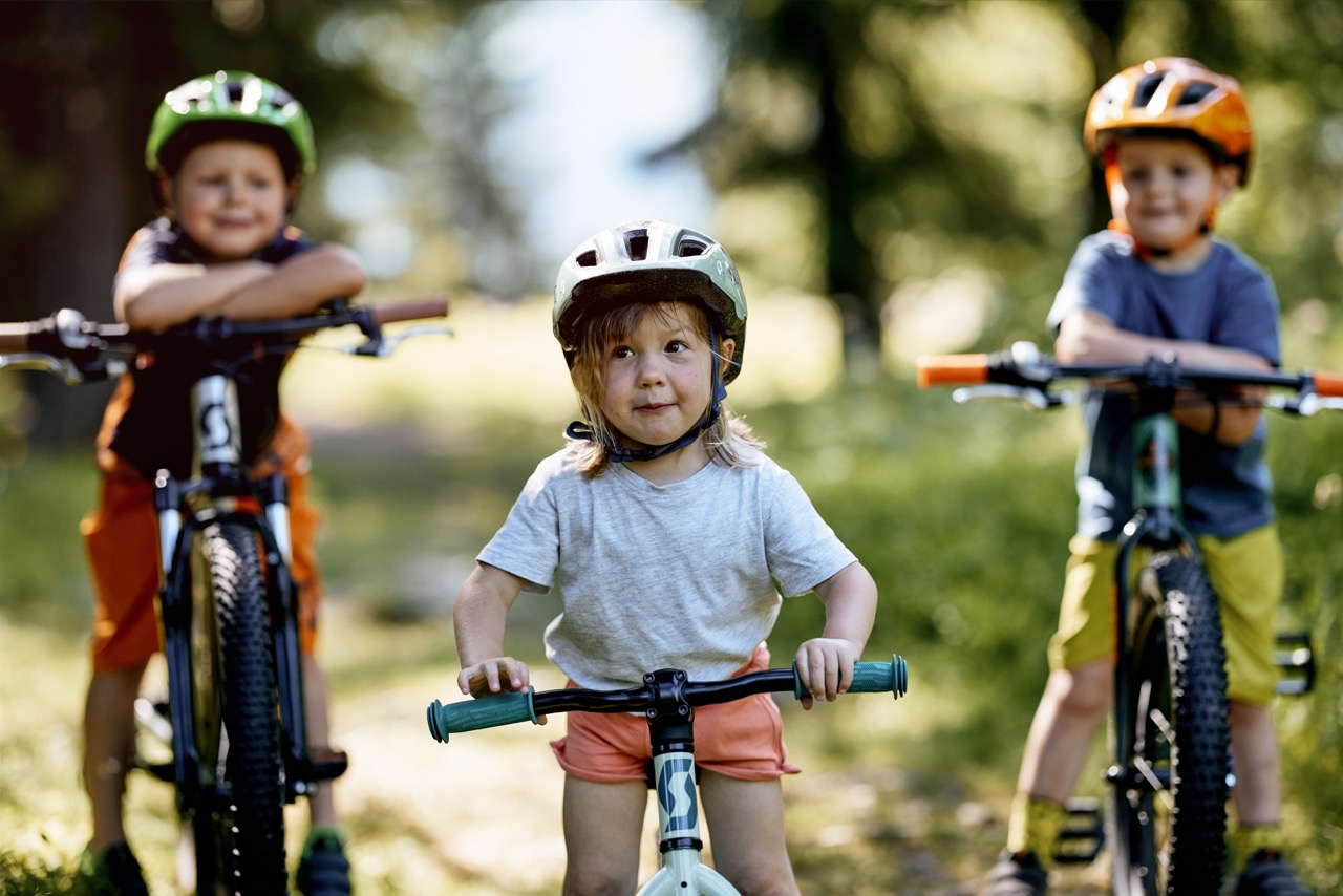 Three little kids on bikes
