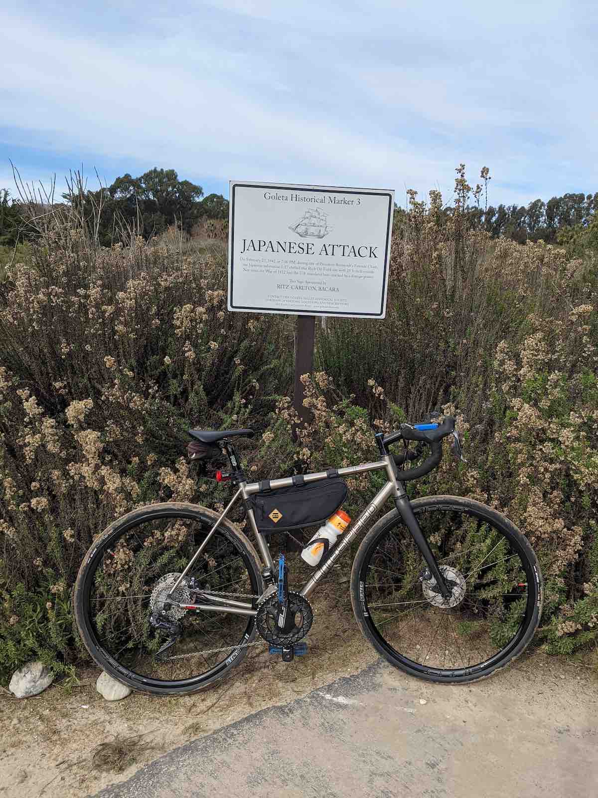 bikerumor pic of the day a litespeed bicycle leans against a sign that is a historical marker describing the japanese attack on us soil of an oil field in Ellwood california.