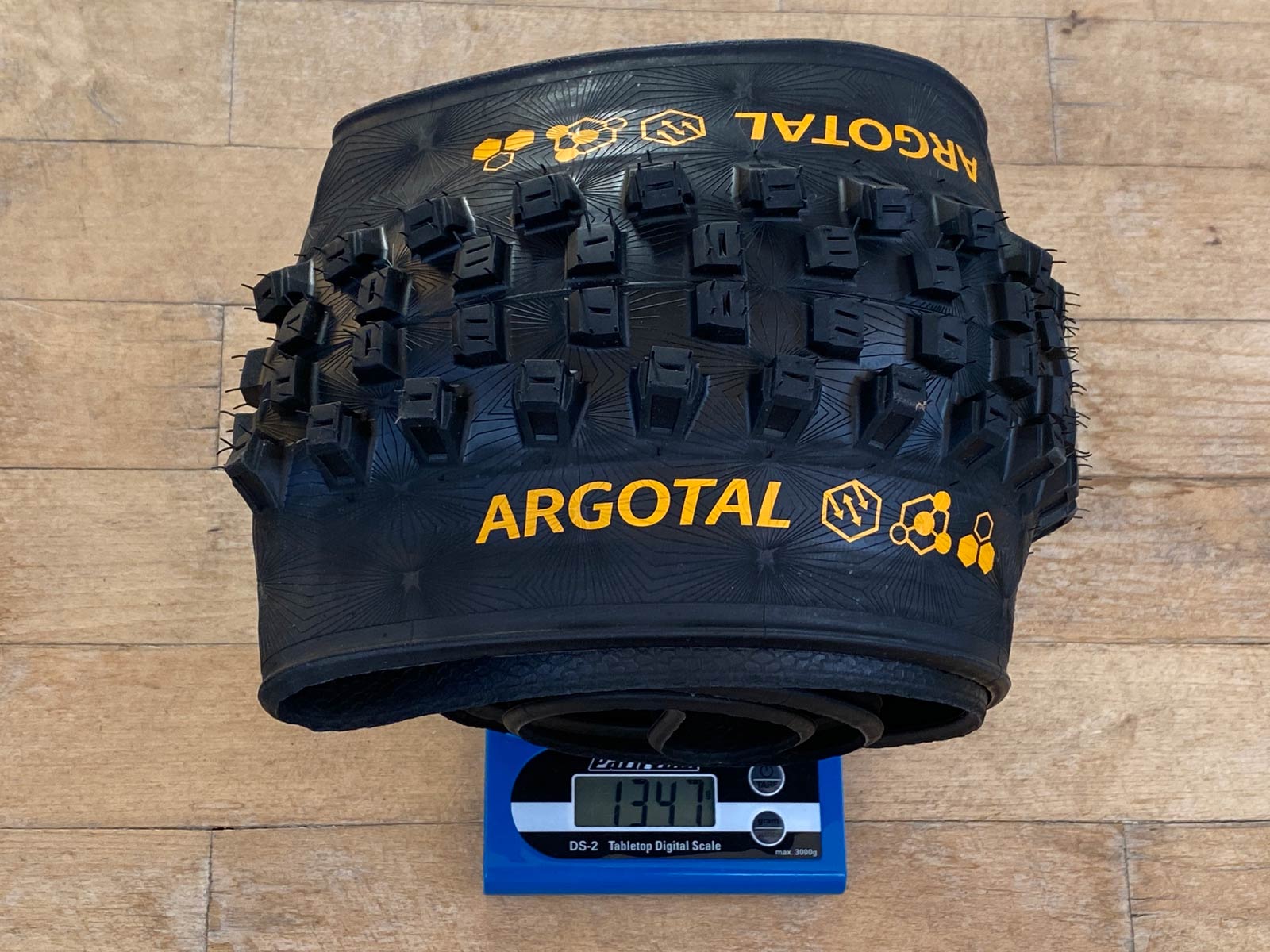 Actual weight of Continental Kryptotal Rear, Trail, Endurance is 1,253g, as measured by our Park Tool DS-2 scale. Credit: Cory Benson