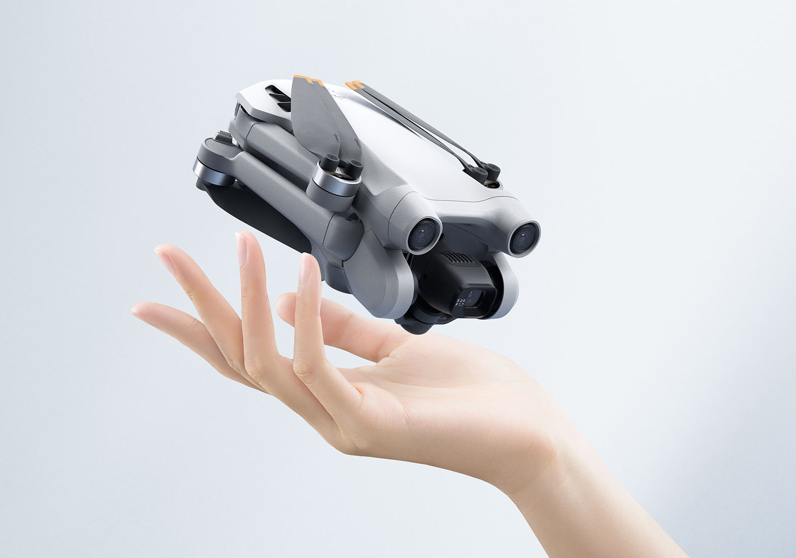 dji mini 3 pro lightweight drone folded up in palm of hand