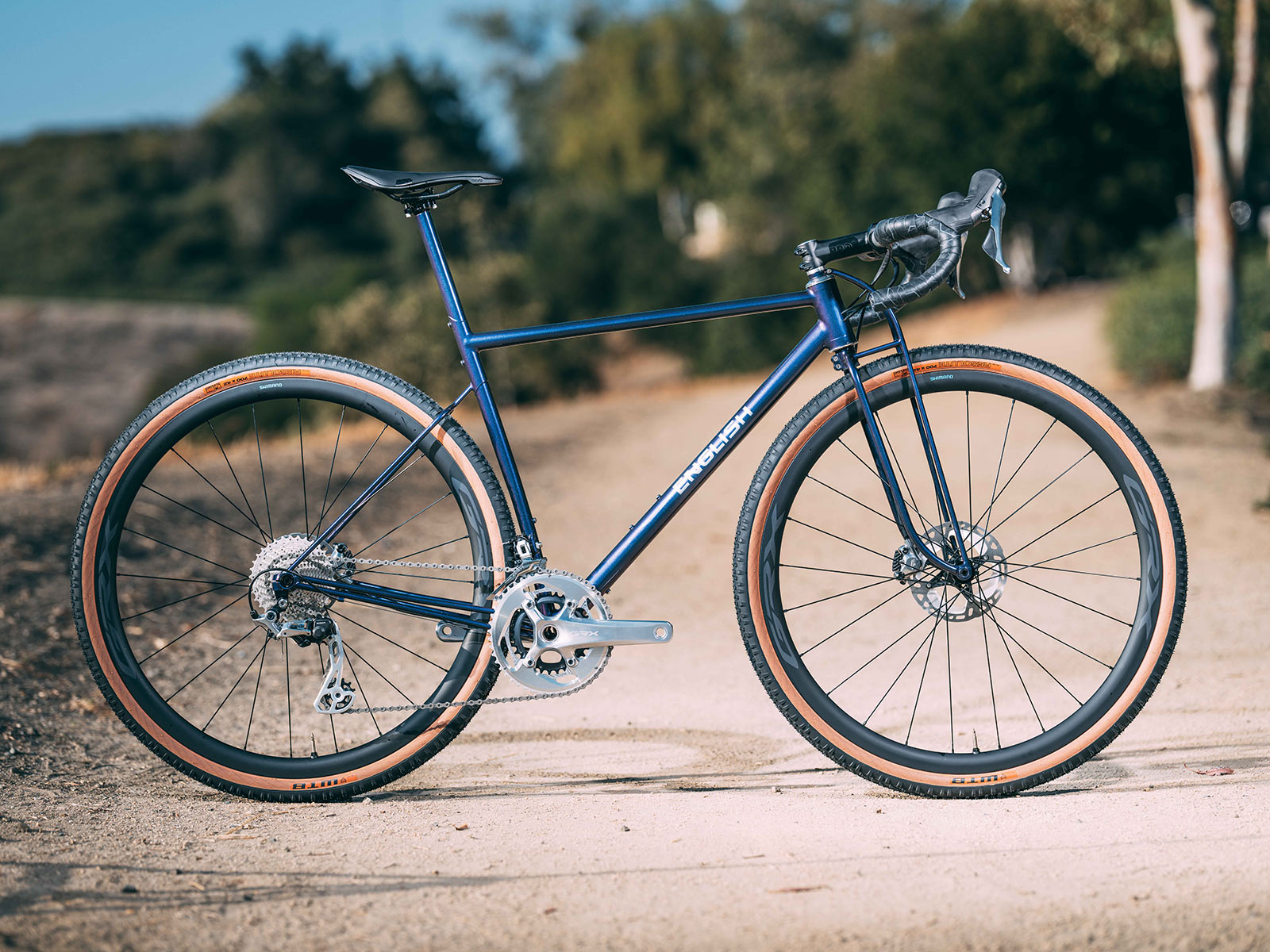 english cycles custom steel gravel bike with shimano grx limited polished silver components