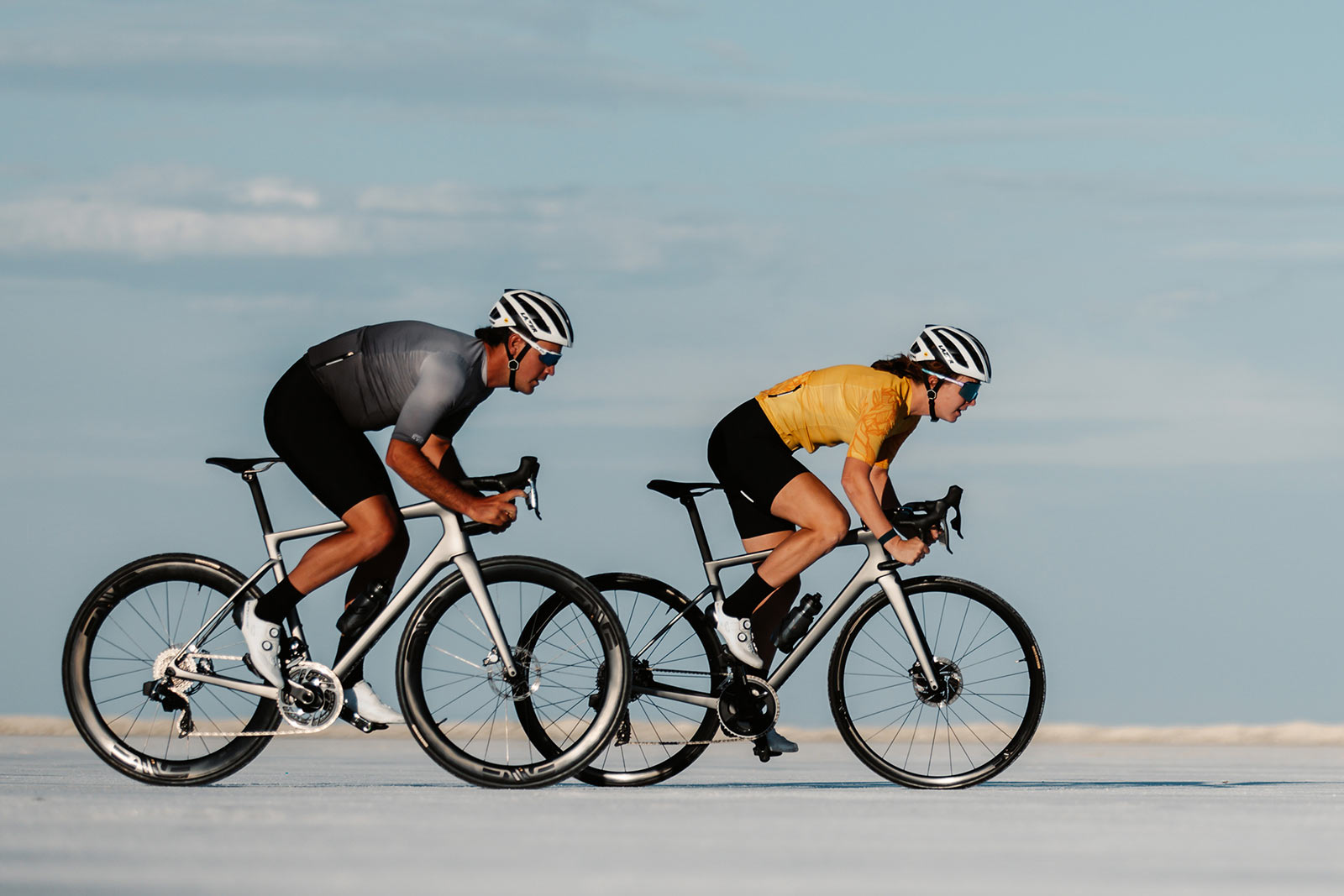 couple riding the new enve melee road bike on the salt flats