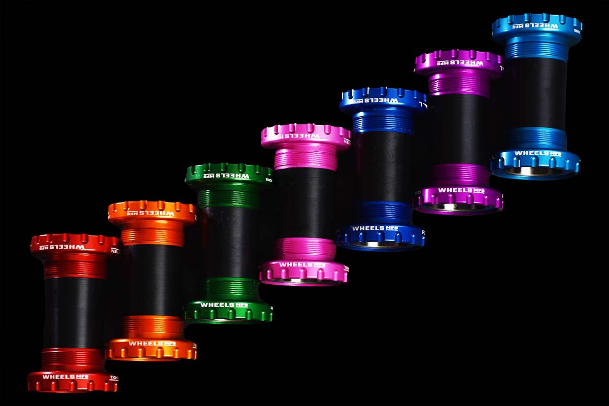 red, orange, green, pink, blue and purple anodized bottom brackets from wheels manufacturing