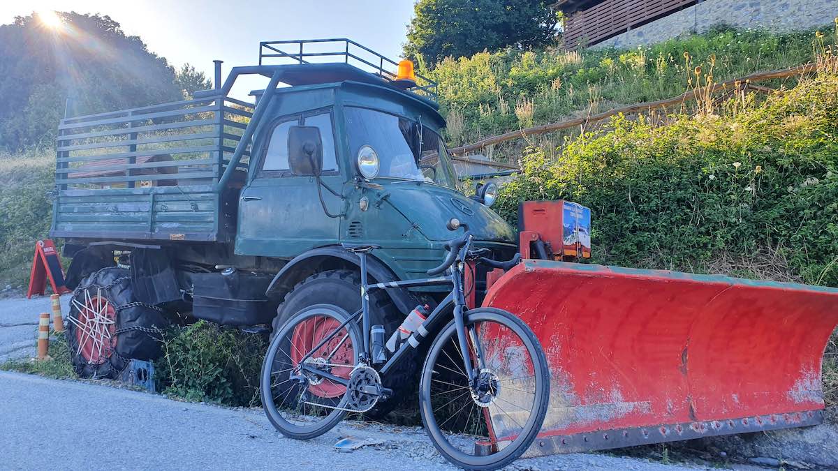 bikerumor pic of the day a bicycle leans against a decommissioned snow plow along a mountain road leading to mount olympus greece