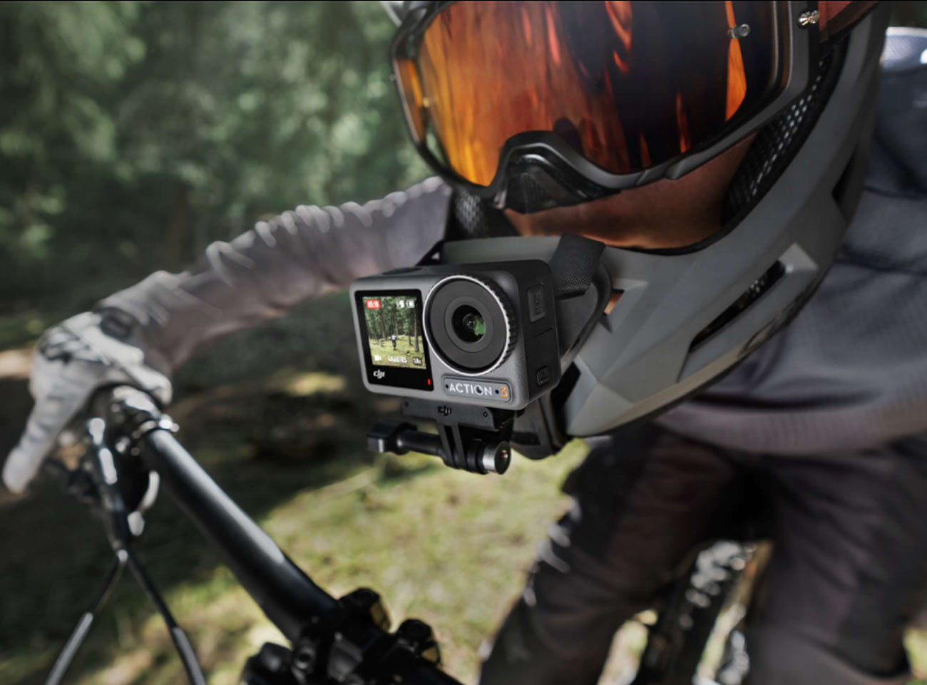 DJi Action 3 camera mounted on the chin bar of a full face mountain bike helmet