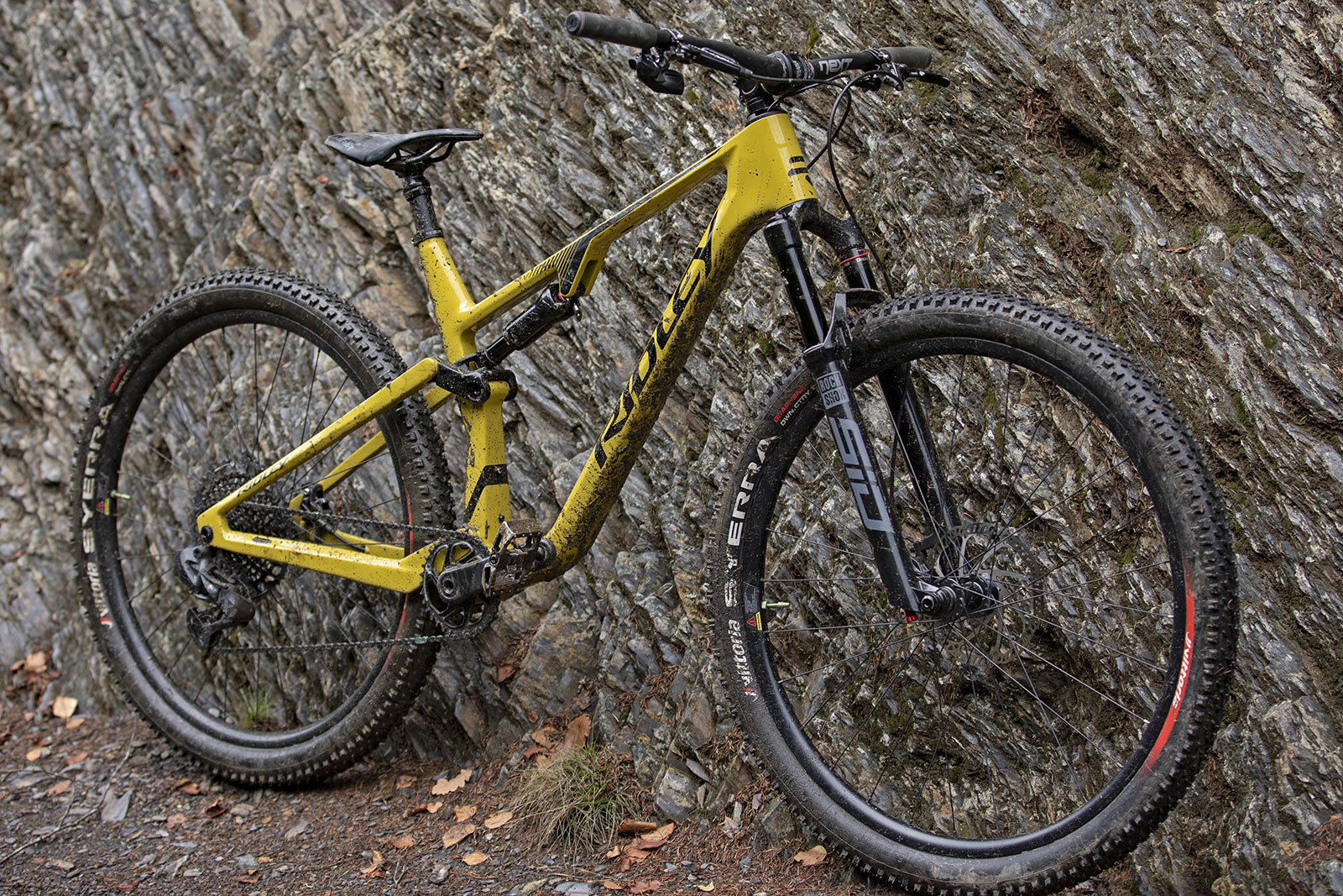 Ridley Raft XC 100mm full-suspension carbon mountain bike, angled muddy