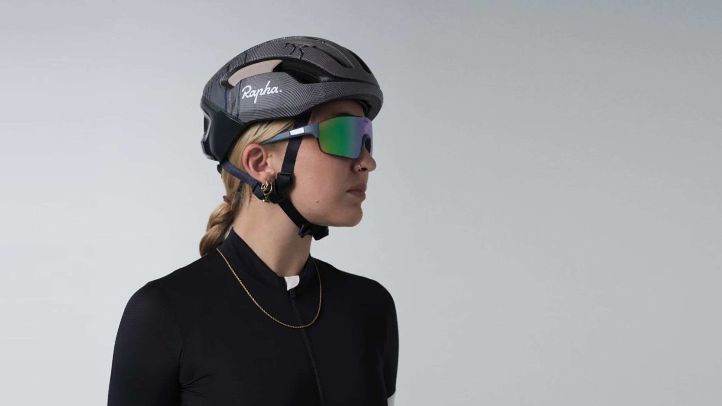 a woman wearing the Rapha + POC Omne Air Mips