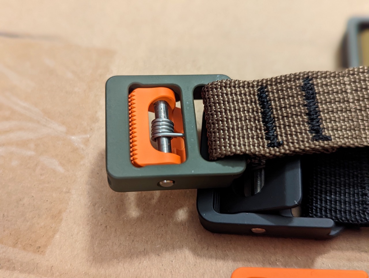 https://bikerumor.com/wp-content/uploads/2022/11/Austere-Manufacturing-Cam-Utility-strap-double-bar-stitch.jpeg