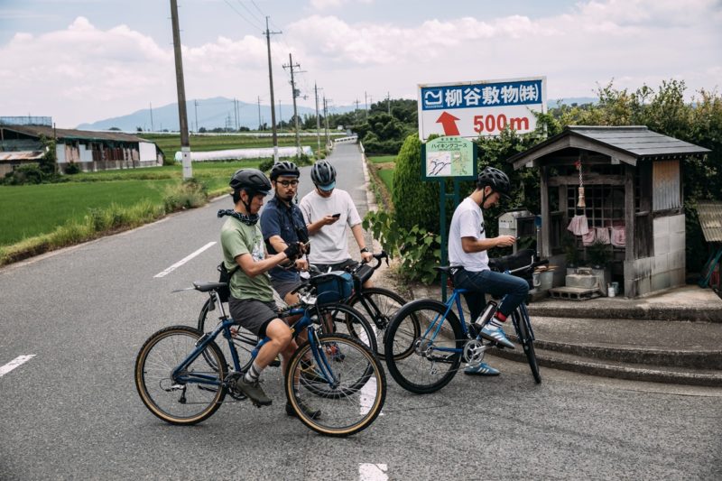 Corner Bikes crew on bikes at a corner